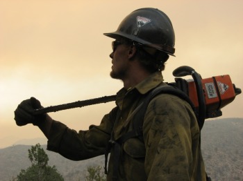 Photo - Firefighter with a chainsaw